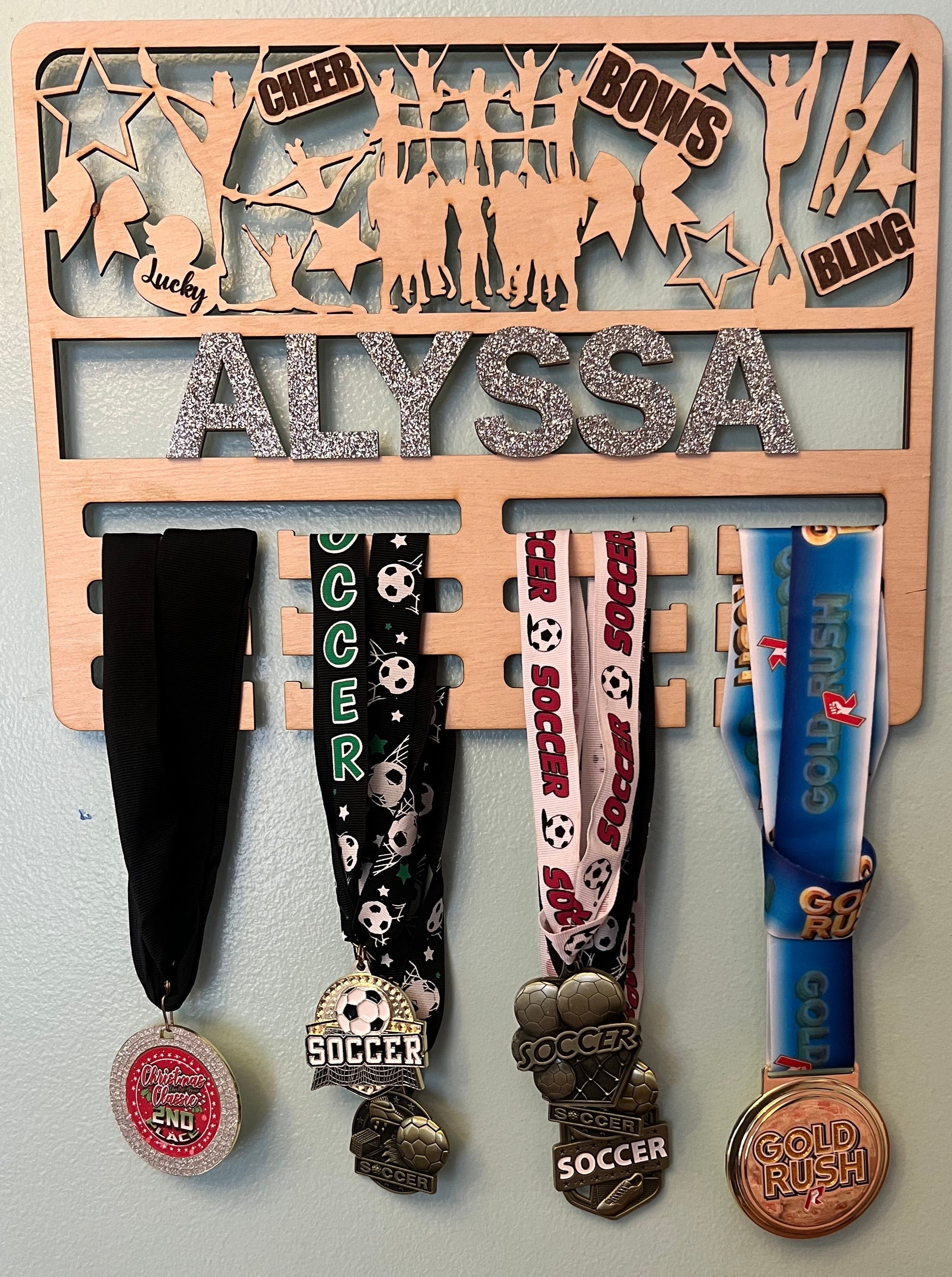 Competitive Cheer Medal Holder – Front View with Glitter and Bows